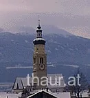 Thaurer Kirchturm vor dem winterlichen Inntal